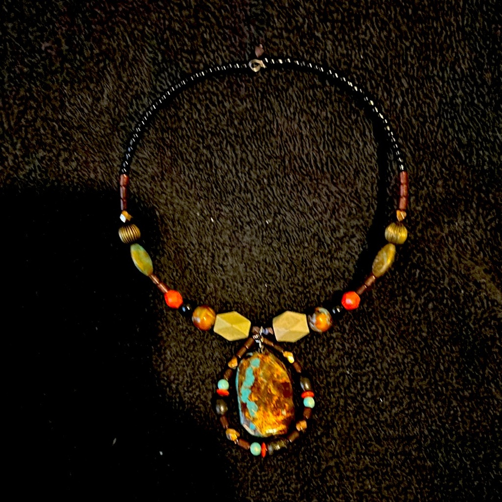 Beaded necklace with multiple shapes and designs of bee and stones